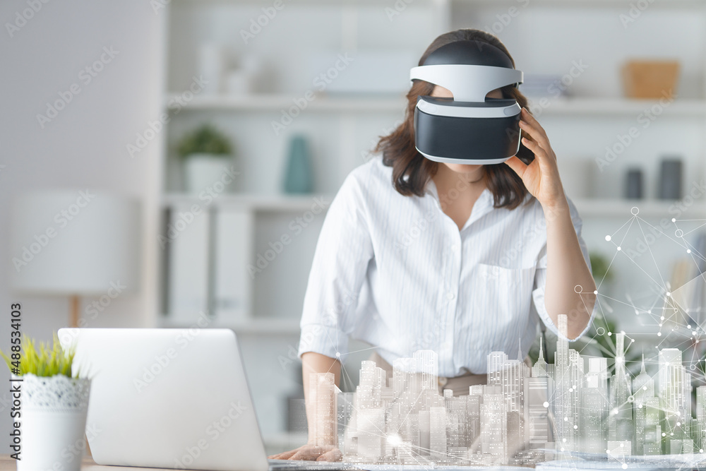 Woman with VR virtual reality goggles