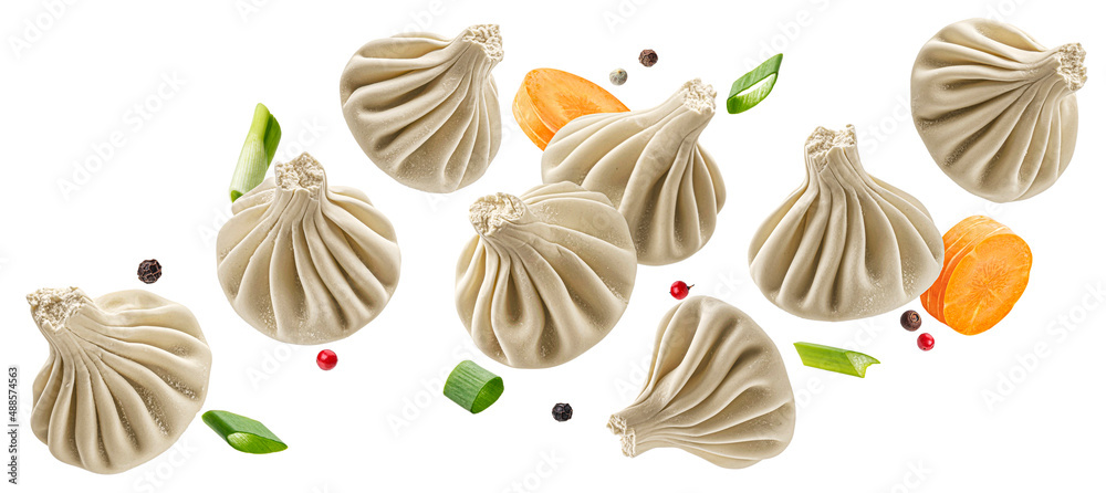 Falling khinkali, frozen dumplings isolated on white background