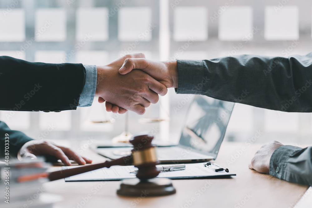 Lawyer business women shaking hands with clients, after finishing up a Consulting for insurance rent