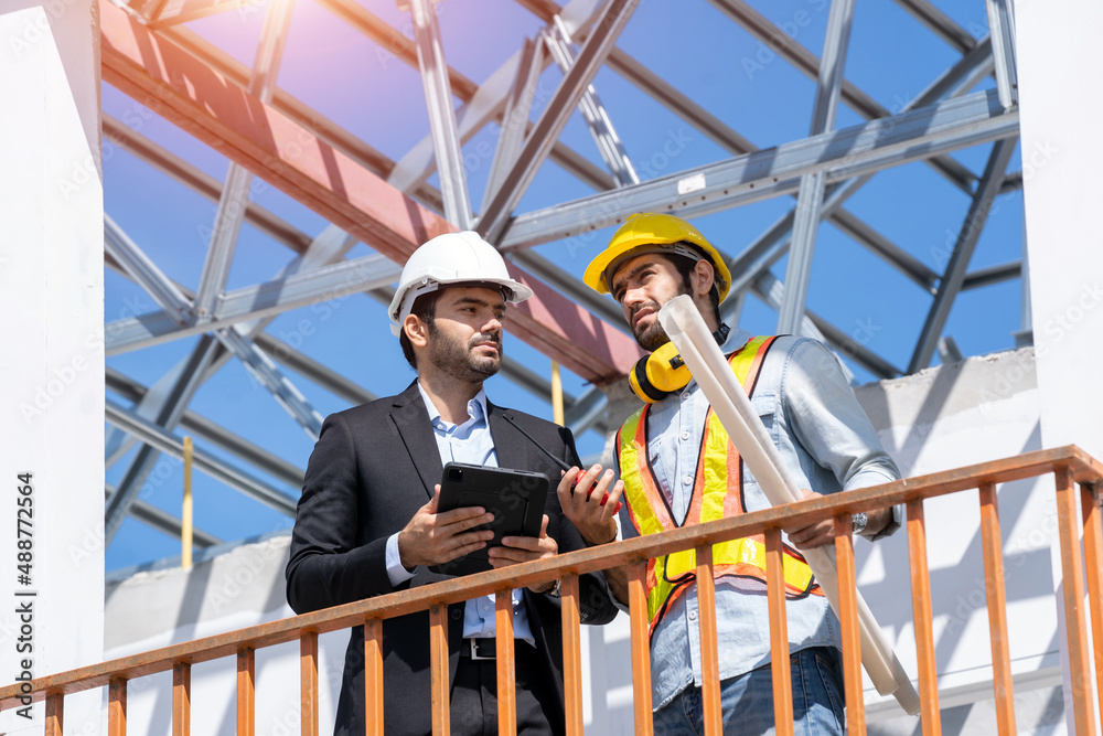 Architect and engineer foreman discussion for plans for new home and working on a building site,Home