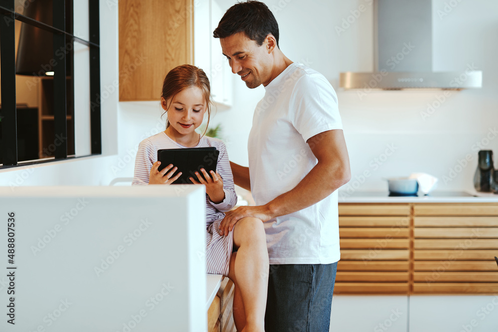 Father and little girl using a tablet