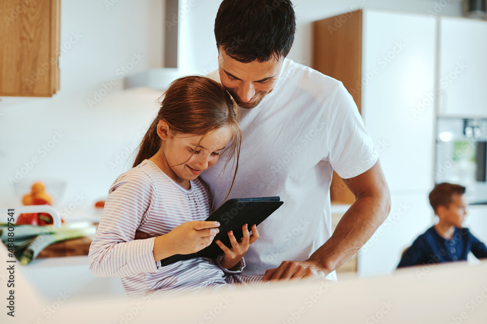 Dad and daughter using a tablet