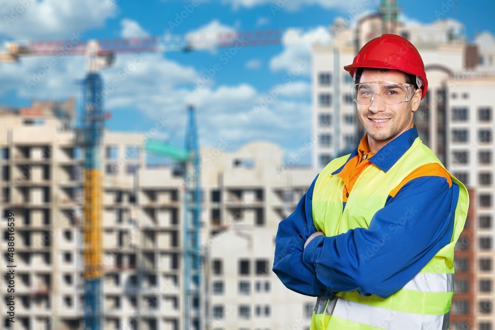 Engineer wearing safety uniform and helmet looking checking and inspection by factory