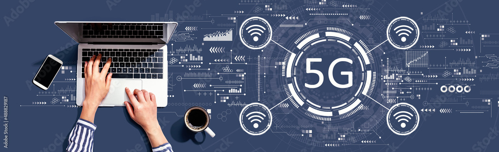 5G network with person using a laptop computer