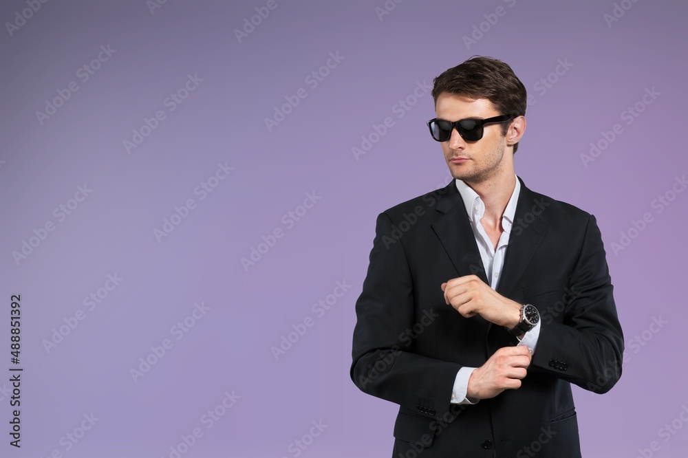 Young successful employee business man posing