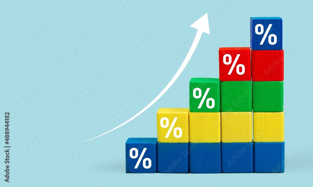 Wooden block signs and symbols with percentage and up arrow financial and business growth