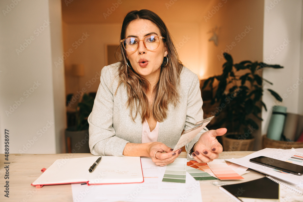 Interior designer speaking during an online meeting