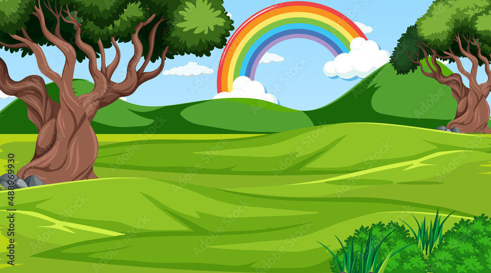 Nature forest scene with rainbow in the sky