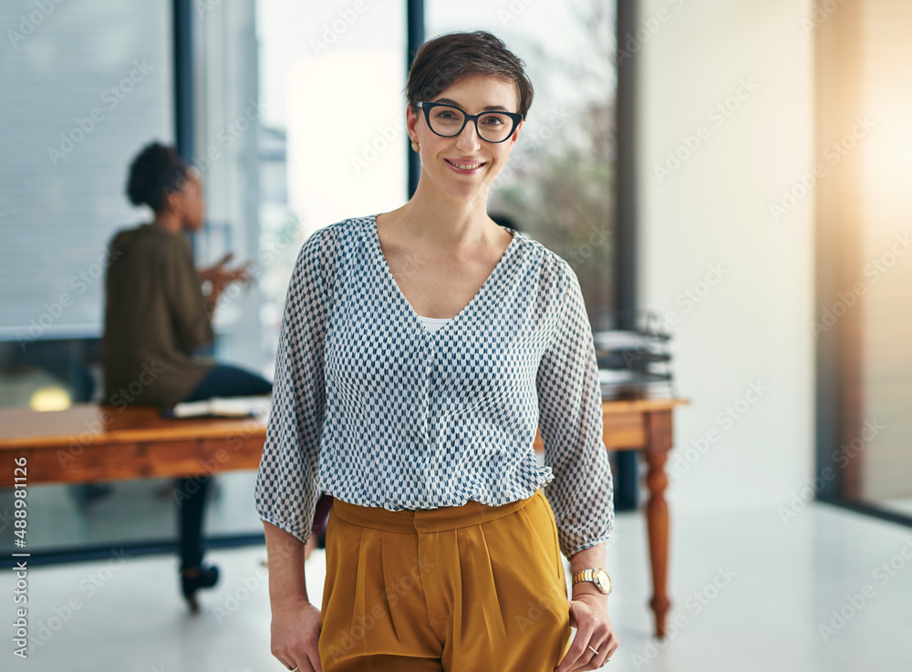 One thing Im sure of is success. Portrait of a young creative standing in an office with colleagues 