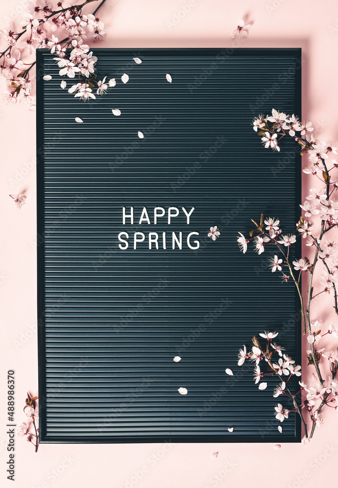 Easter background with letter board and spring flowers