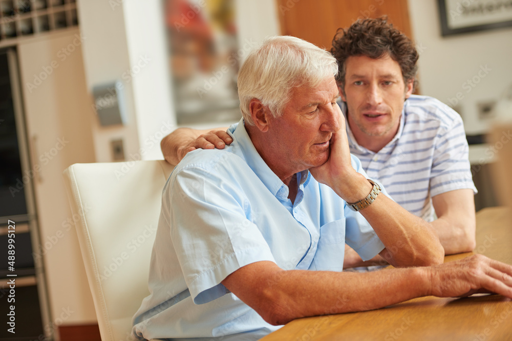 There to support each other. Shot of a man consoling his senior father at home.