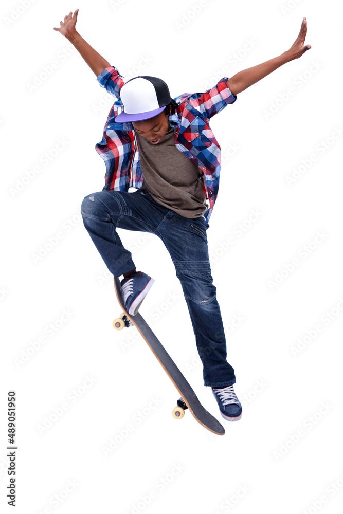 Born for boarding. An African-American boy doing a trick on his skateboard.