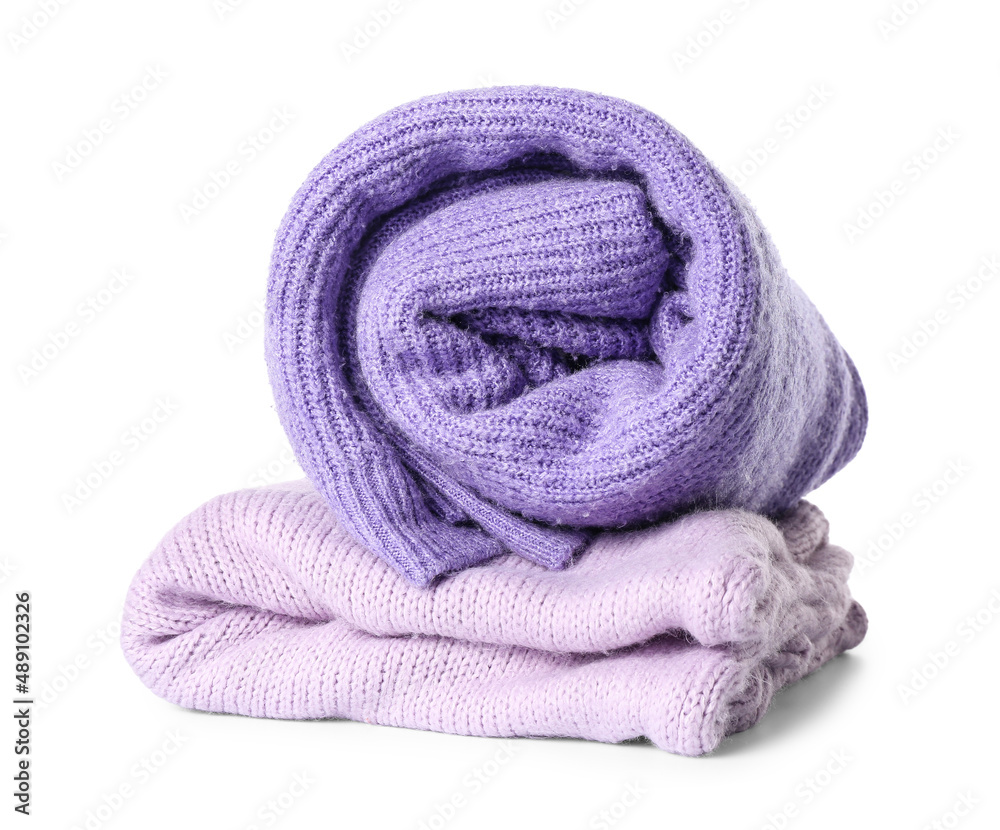 Knitted lilac sweaters on white background