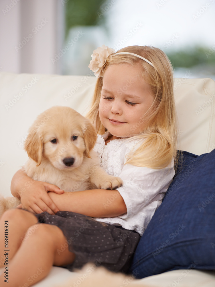 Well be best friends forever. Cropped shot of a little girl holding a puppy.