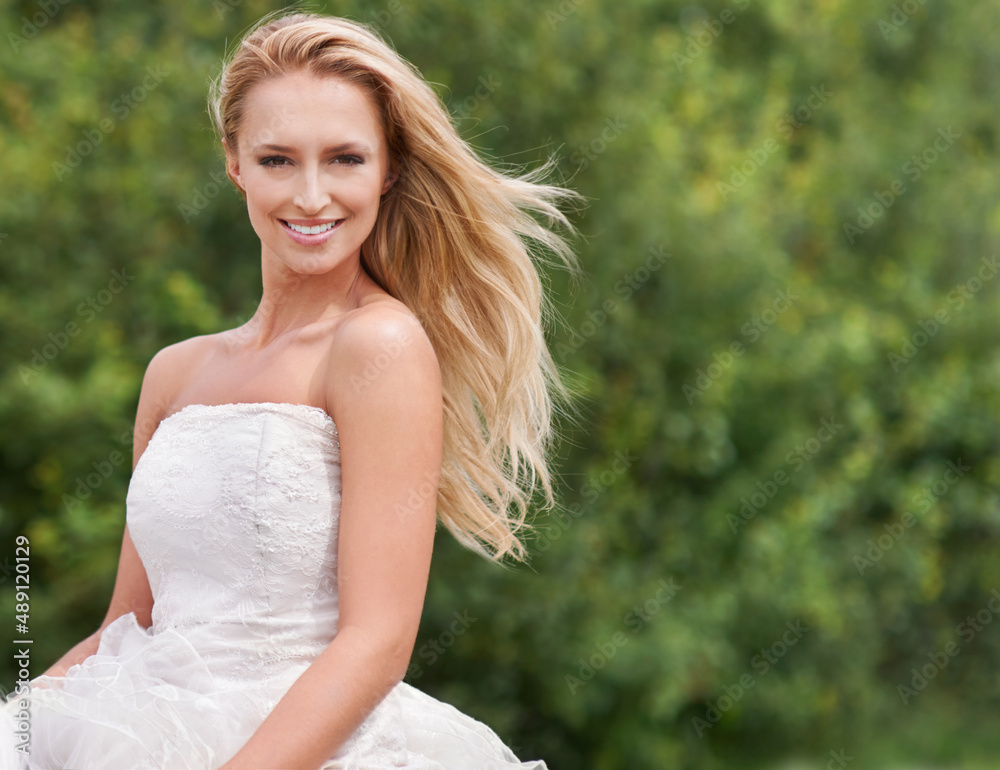 Stunning on her big day. A gorgeous young bride smiling and looking stunning in her wedding dress al