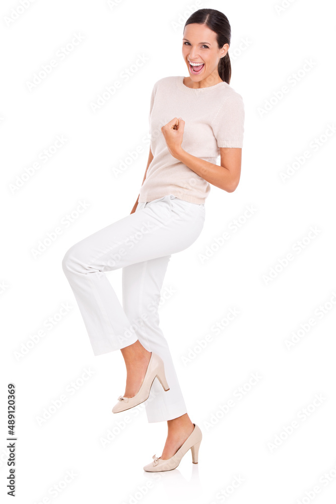 Have I got something for you. Full-length studio portrait of an attractive young woman looking excit