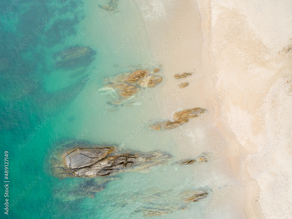 Aerial view sandy beach and crashing waves on sandy shore Beautiful tropical sea in the morning summ