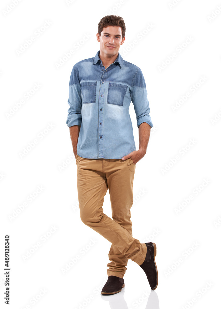 Having a relaxed day. A handsome young man standing against a white background.