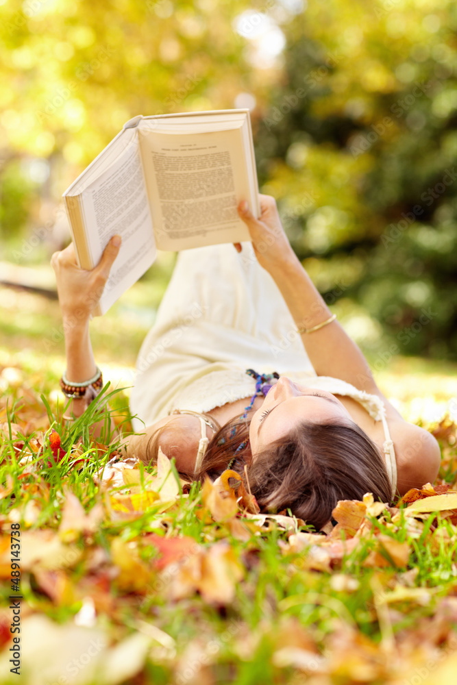 Autumn beauty. Shot of an attractive young woman in the park on an autumn day.