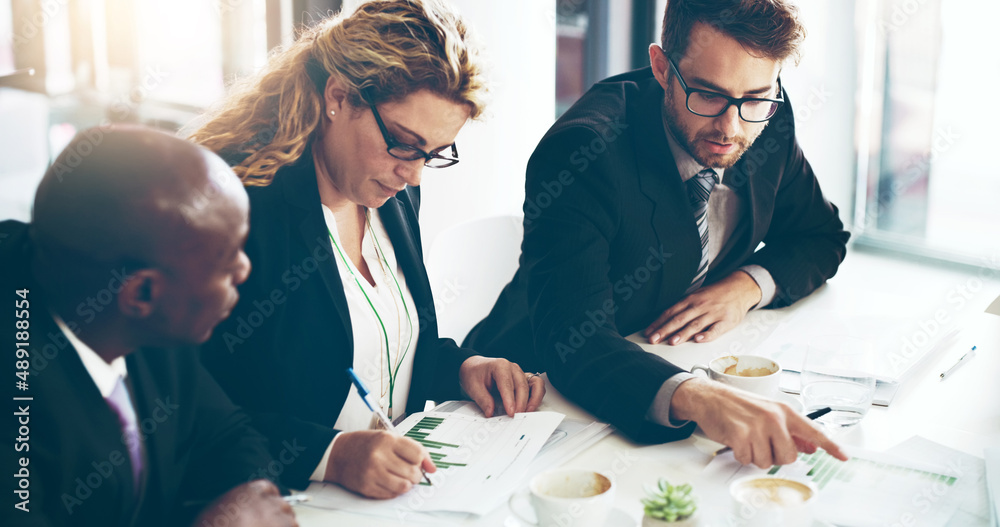 Theyll come up with a strategy. High angle shot of a group of corporate businesspeople looking at pa