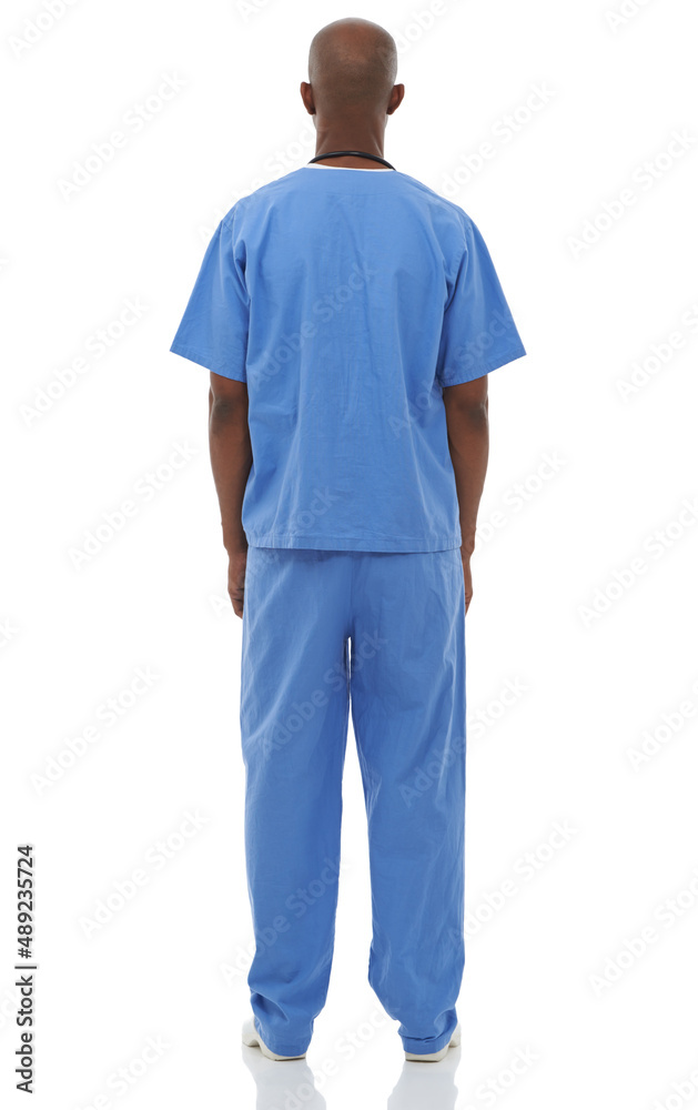 Hes a great doctor. Studio shot of a young african doctor with his back facing the camera.