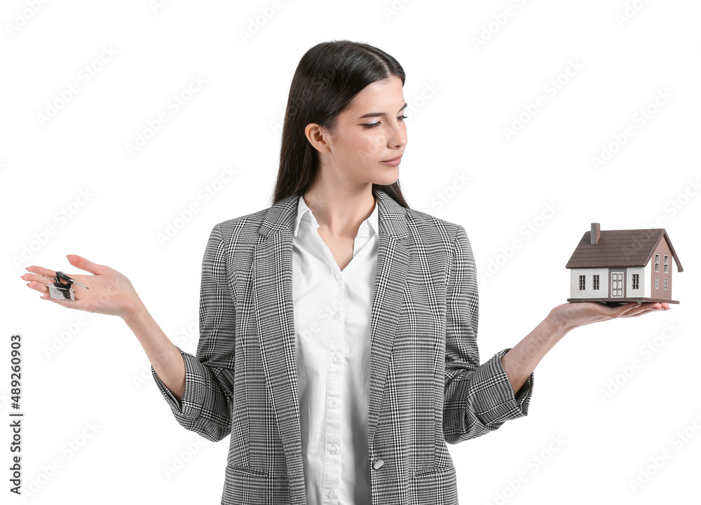 Real estate agent with figure of house and key on white background