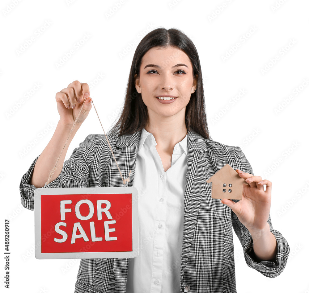 Female real estate agent with For Sale