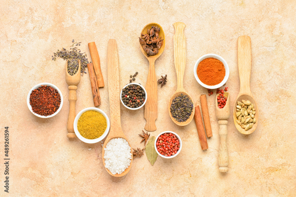 Set of aromatic spices on beige background