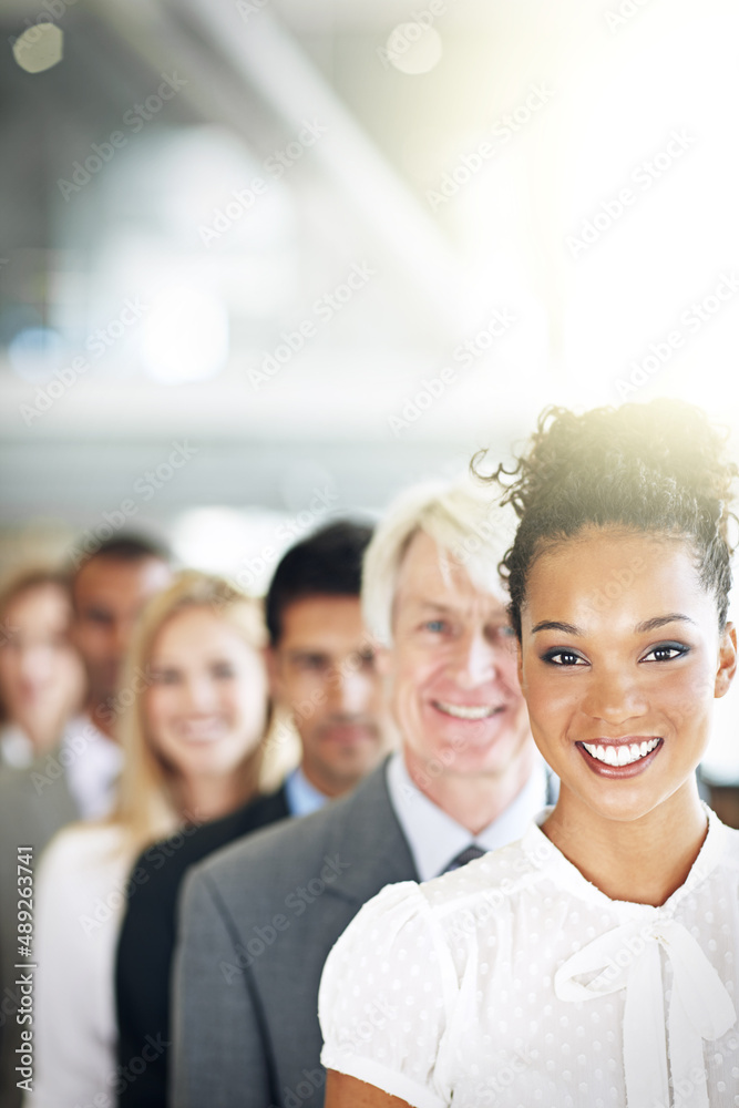 The best in the business. Cropped portrait of a group of diverse businesspeople standing in a line.