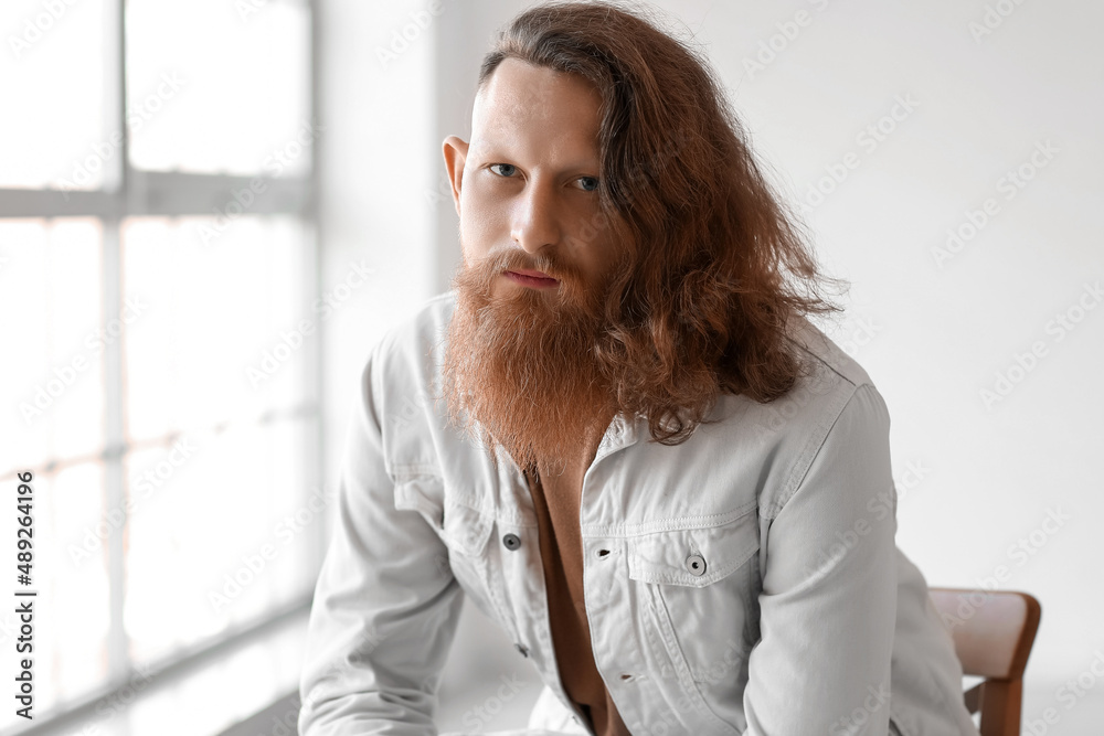 Portrait of handsome bearded man at home