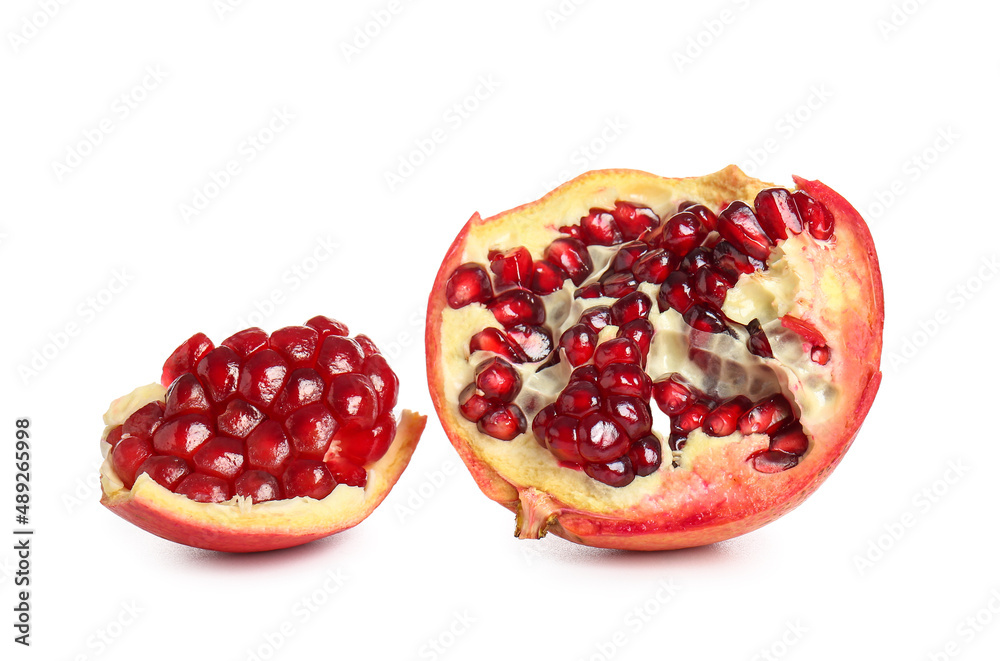 Tasty pomegranate pieces on white background