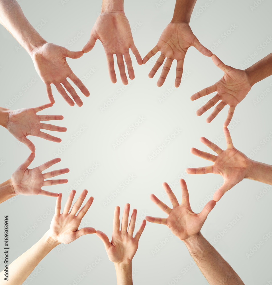 All for one and one for all. Low angle shot of hands in a circle forming a circle.