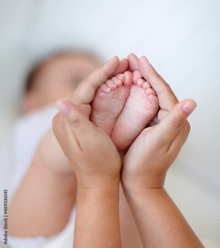 Babies are so precious. Cropped shot of a mother holding her baby.