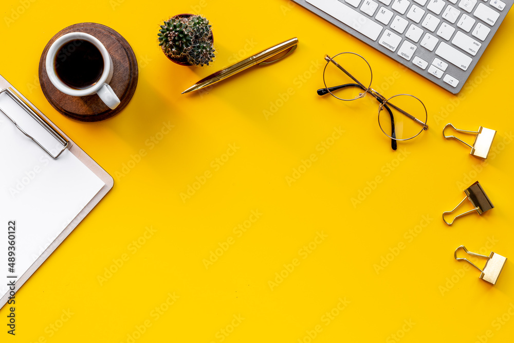 Top view of office working place with computer and cup of coffee