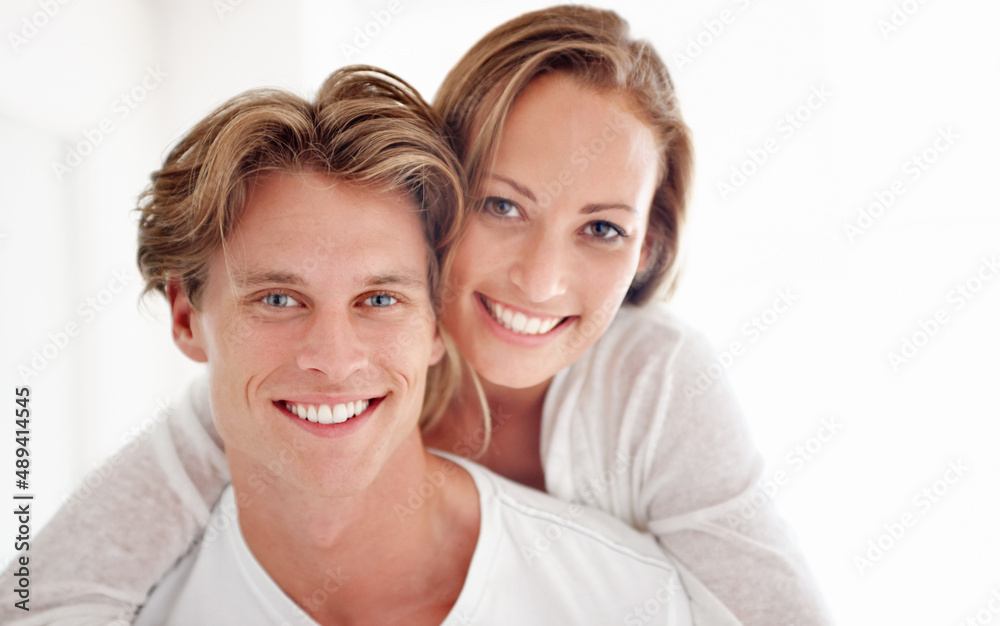 I cant get enough of you. A happy young couple having an intimate moment in their home.