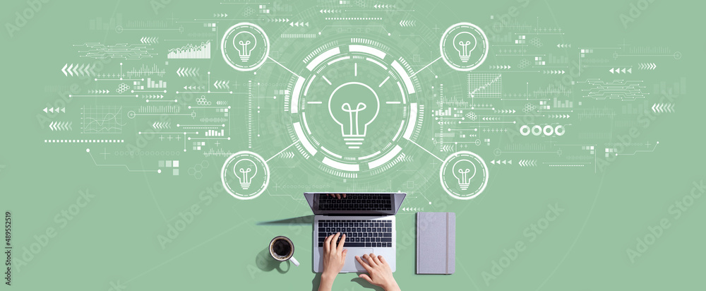 Idea light bulb theme with person working with a laptop