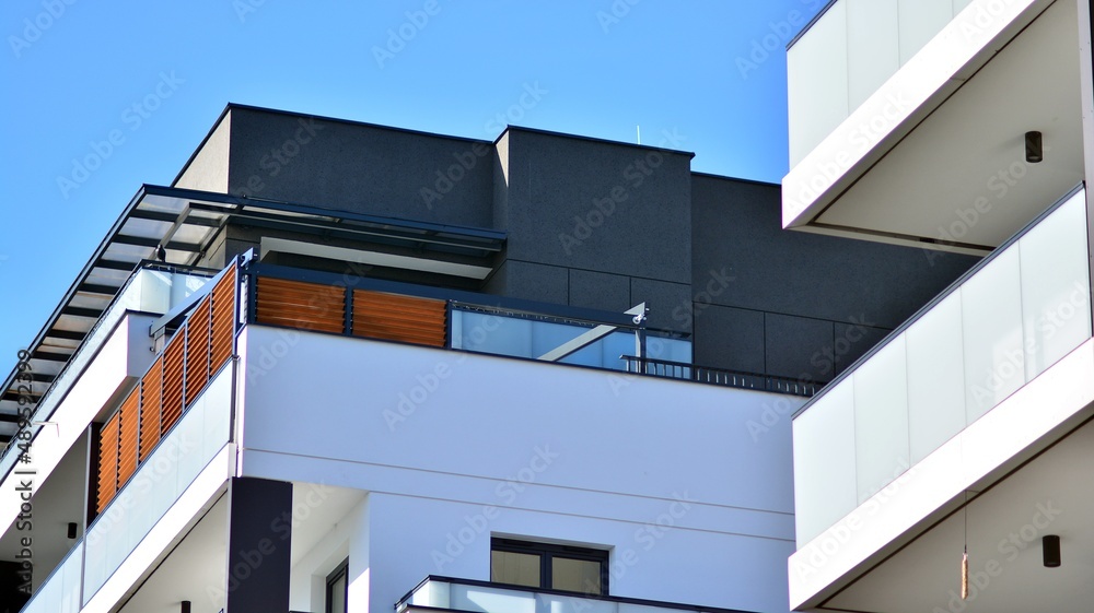 Fragment of modern residential apartment with flat buildings exterior. Detail of new luxury house an