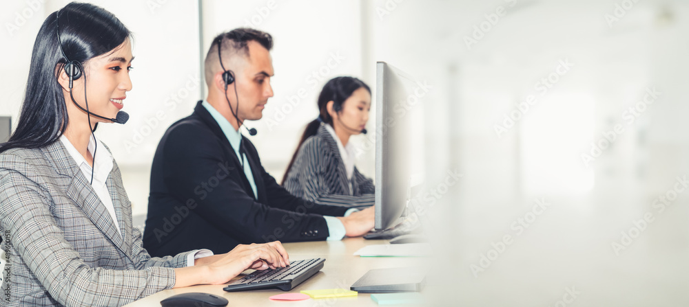 Business people wearing headset working in office to support remote customer or colleague. Call cent