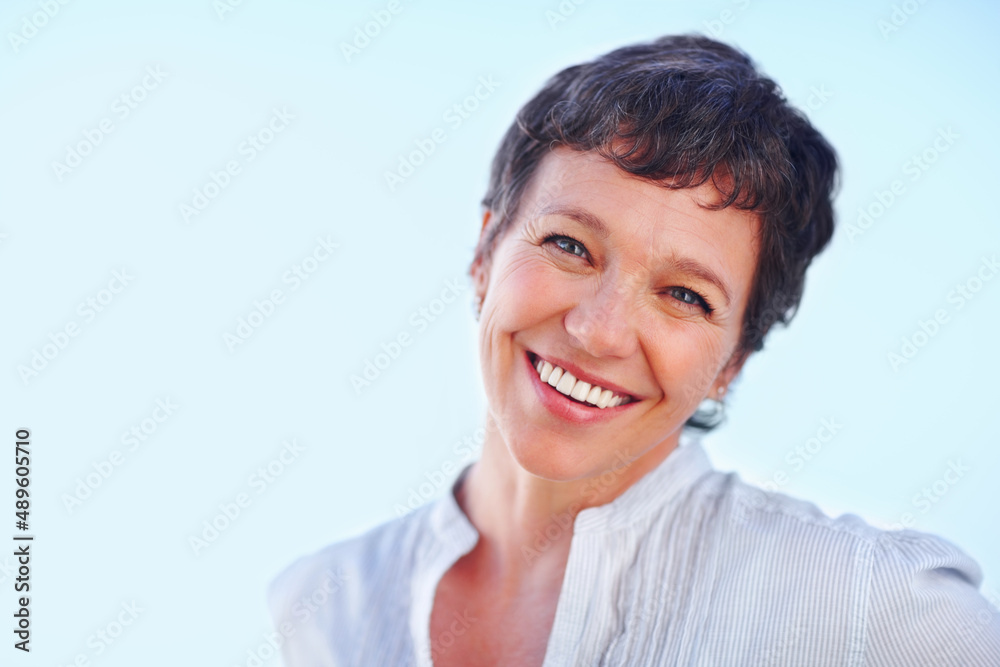 Happy mature business woman smiling. Portrait of mature business woman smiling over white background