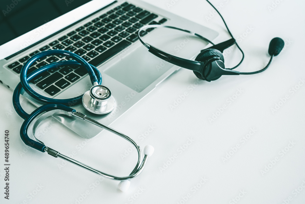 Headset and doctor equipment at clinic ready for actively support for patient by online video call .