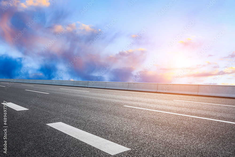 Empty asphalt road and beautiful sky sunset clouds background