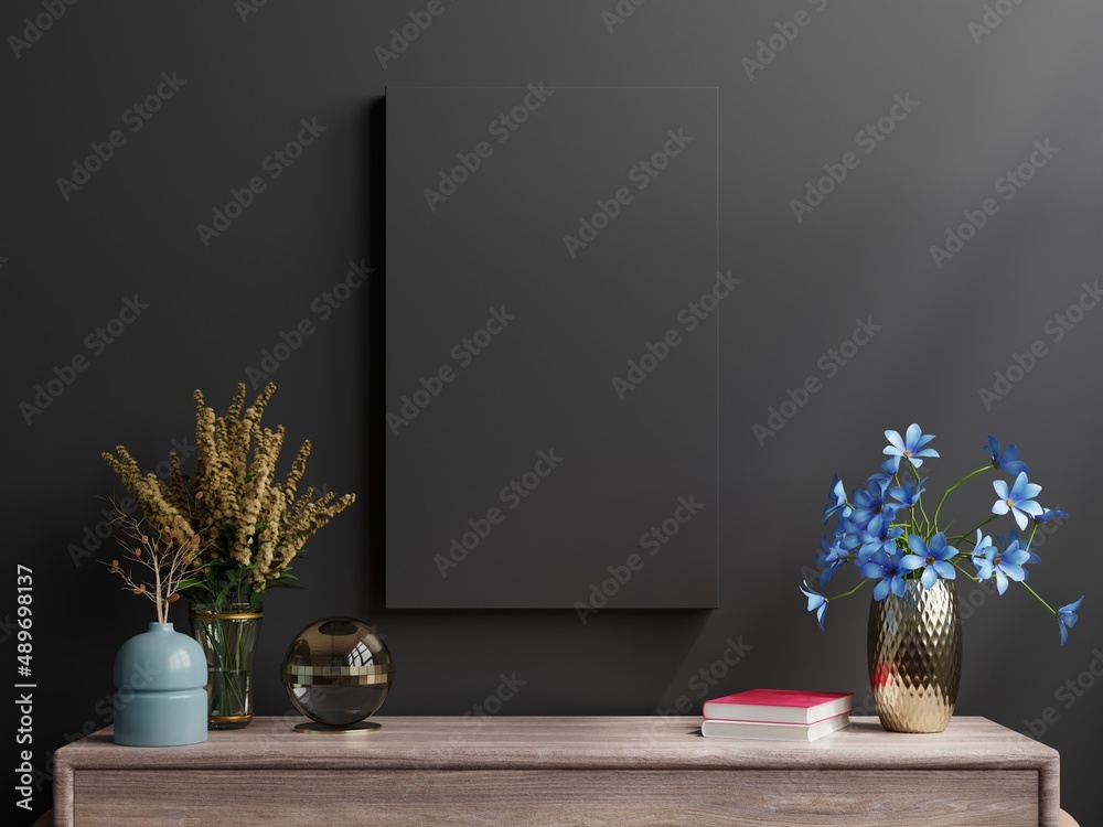 Mockup dark frame on cabinet in living room interior on empty black wall background.