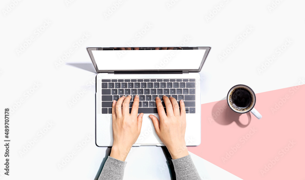 Person using a laptop computer from above