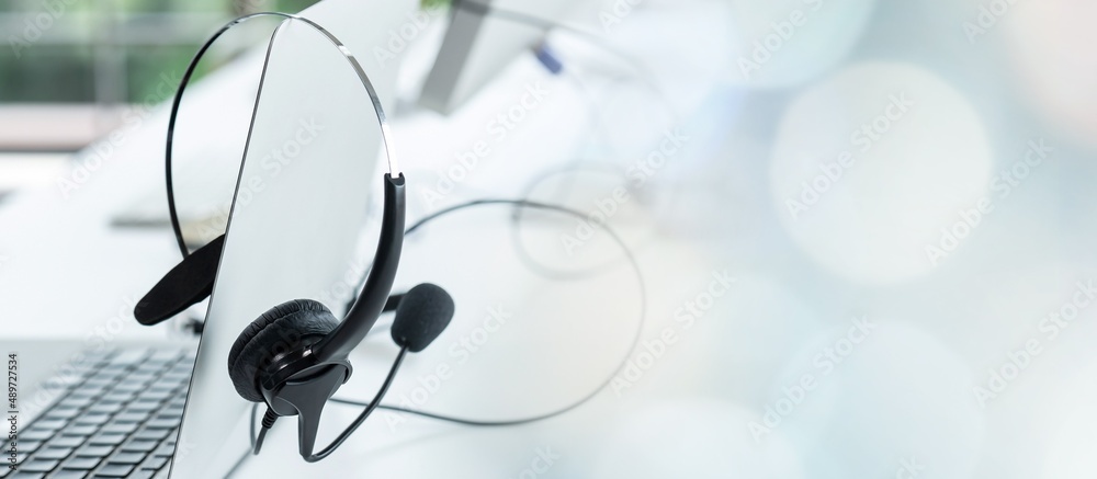 Headset and customer support equipment at call center ready for actively service . Corporate busines