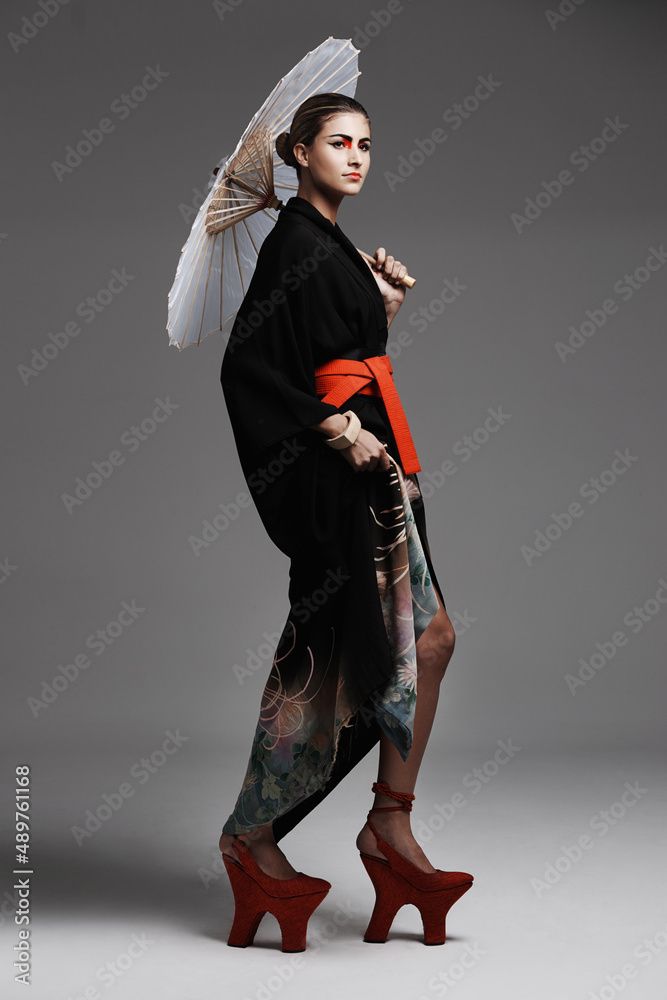 Traditional style. Studio fashion shot of a young woman wearing oriental-style clothing.