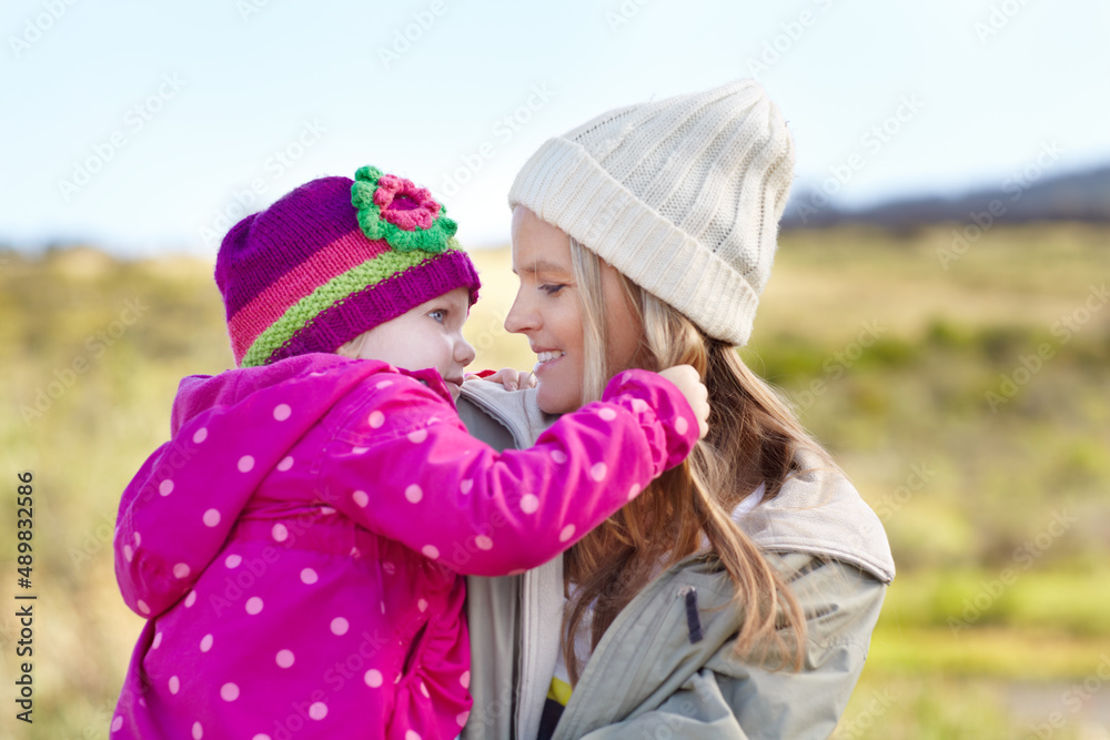 Enjoying some fmaily time outdoors. A young mother with her little girl while on a hiking trip.