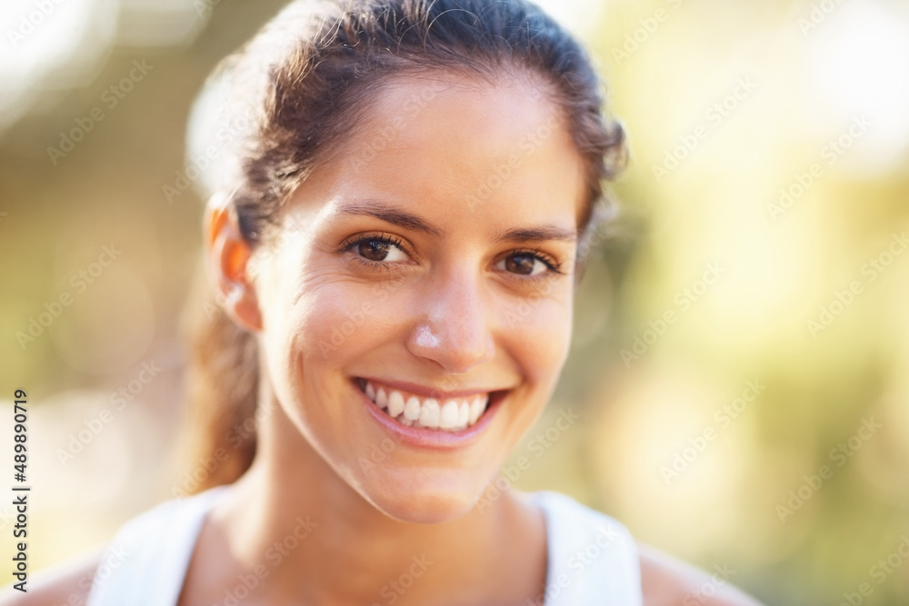 Woman giving a cute smile. Closeup of woman giving a cute smile.