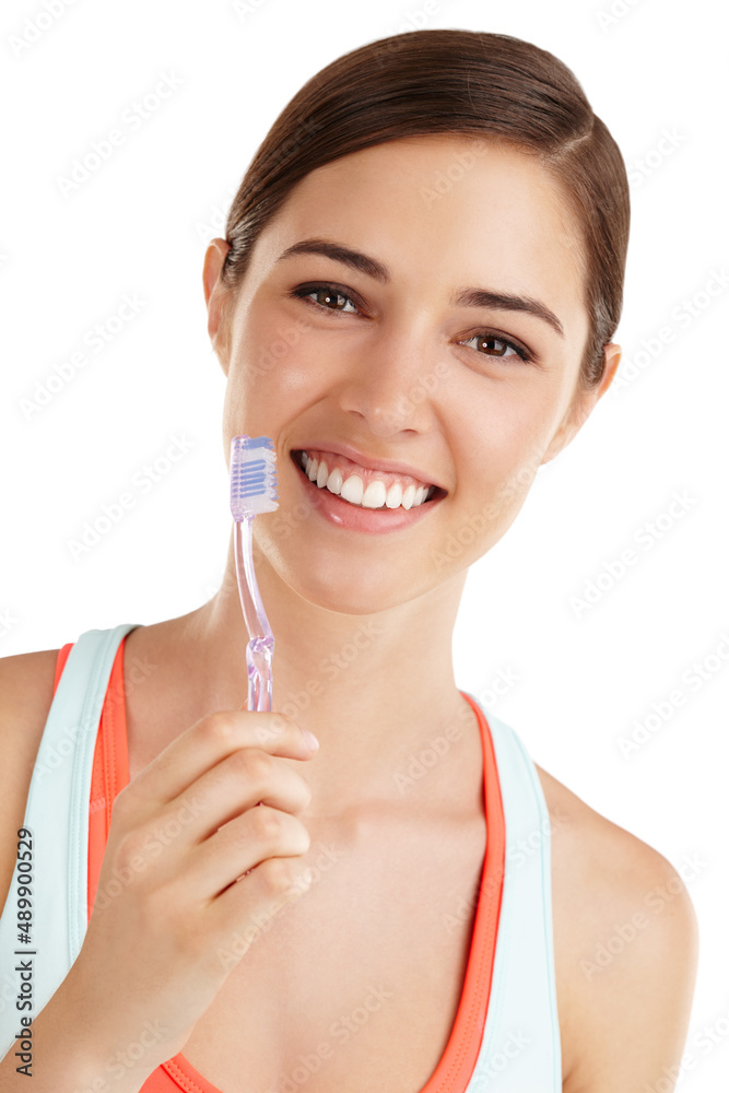 Give yourself something to smile about. Beautiful young lady holding toothbrush and smiling.