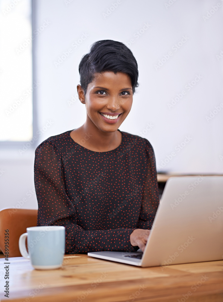 My Ive just had my morning coffee smile. A portrait of a beautiful young woman sitting at a desk and