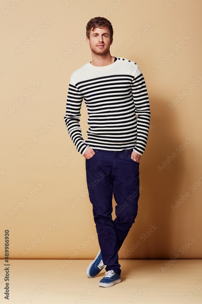 Style is my game. Full length studio portrait of a stylishly-dressed young man smiling at the camera